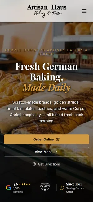 Artisan Haus Bakery & Bistro website on a phone